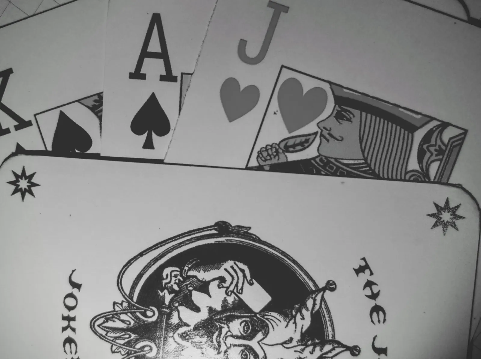 Playing cards on a table, suggesting chance and inheritance